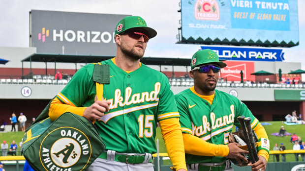 Mar 2, 2023; Mesa, Arizona, USA; Oakland Athletics first baseman Seth Brown (15) and second baseman Tony Kemp (5) look on prior to a Spring Training game against the Chicago Cubs at Sloan Park . Mandatory Credit: Matt Kartozian-USA TODAY Sports